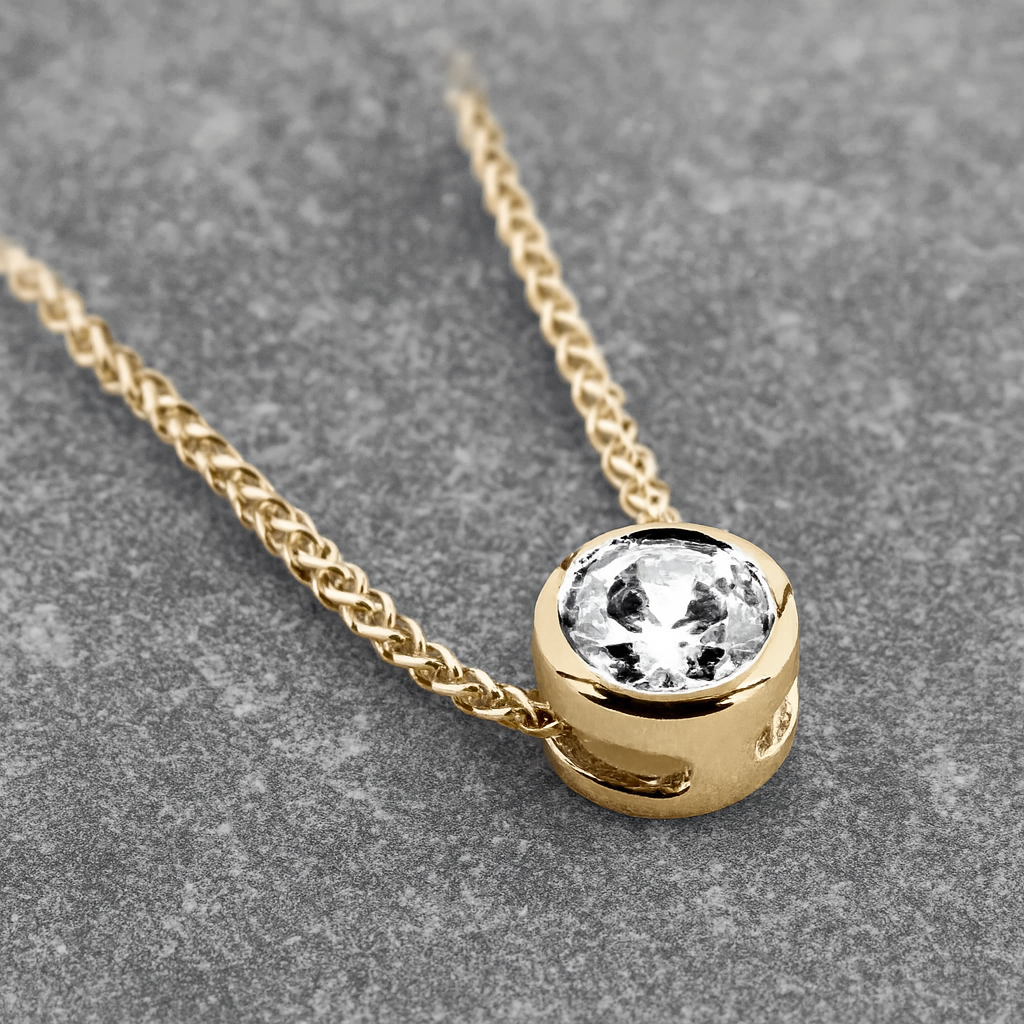 Pendentif en or jaune et diamant Pure, serti clos sans bélière