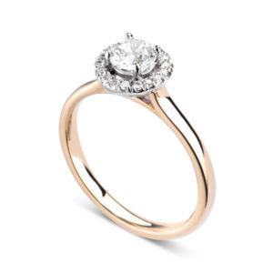 Éblouissante : Bague de fiançailles en or rose 18k avec halo serti de diamants. Halo serti dressé 16 diamants G/VS total 0.07 carats.