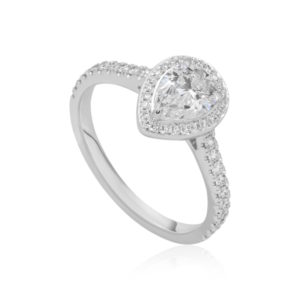 Passionnée : Bague diamant poire en or blanc 18k à halo et épaulée de diamants. Halo et épaules serties 48 diamants G/VS total 0.21 carats.