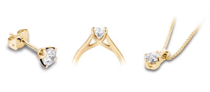 Parure en or jaune composée de puces d'oreilles, d'une bague et d'un pendentif en diamant