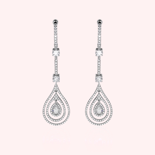 Boucles d'oreilles pendantes en diamant pour femme conçues sur mesure par Hauthentic, présentant un triple halo.